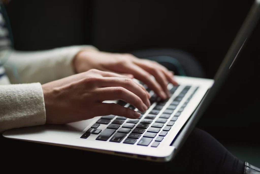 A person working at computer signifying Git checkout remote branch